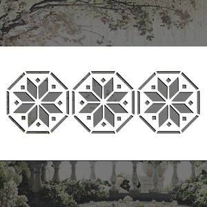 May include: A stencil with three gray octagonal designs featuring a starburst pattern. The stencil is on a white background.