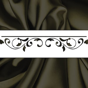 May include: A black and white stencil featuring a decorative, ornate, floral design. The design is symmetrical and features a repeating pattern of leaves and swirls.