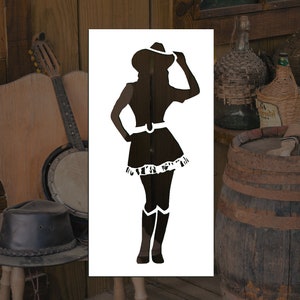 May include: A black and white silhouette stencil of a woman wearing a cowboy hat and boots. The stencil is on a white background.