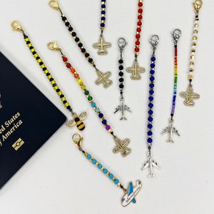 Zipper pull with airplane or other charms. Great gift for cabin crew, flight attendants or travellers