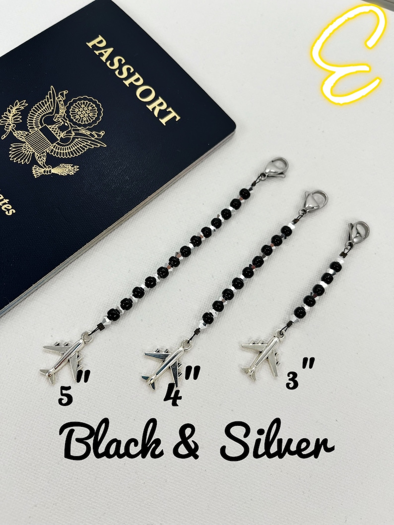 May include: Three black and silver beaded chains with airplane charms. The chains are 3, 4, and 5 inches long. The text "Black & Silver" is written below the chains.