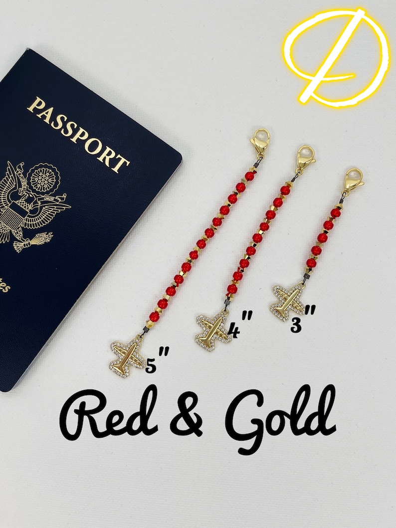 May include: Three red and gold beaded chains with airplane charms. The chains are 3, 4, and 5 inches long. The text "Red & Gold" is written below the chains.
