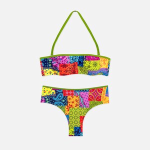 May include: A two-piece bikini set featuring a vibrant, multi-colored patchwork bandana print. The top is a halter-style bandeau with lime green trim, and the bottom is a classic cut bikini brief with matching lime green trim along the waistline.