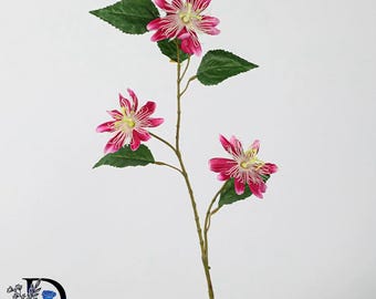May include: A single artificial stem featuring three vibrant magenta passion flowers with intricate white filaments at the center. The stem includes several dark green, serrated leaves attached to a thin, brown, textured branch-like stalk.