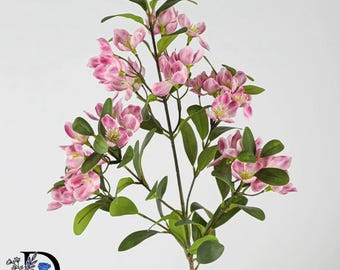 May include: A faux botanical stem featuring multiple clusters of small, five-petaled pink and white flowers with yellow centers. The branch has dark brown stems and numerous smooth, oval-shaped green leaves arranged along the branching structure.