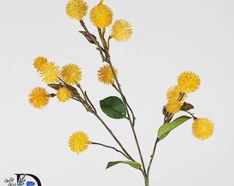 May include: A decorative artificial floral stem featuring multiple bright yellow, spiky, spherical flower heads attached to thin, brown, branching stems with small, pointed green leaves distributed along the length of the plant structure.