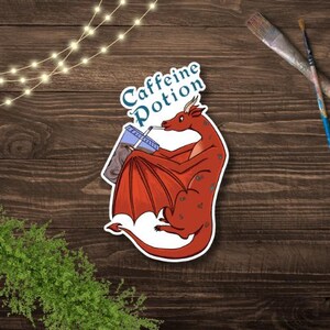 Caffeine Potion Dragon Sticker – Cute Red Dragon Drinking Iced Coffee – Waterproof Vinyl – Fantasy Coffee Sticker – Magical Creature Decal