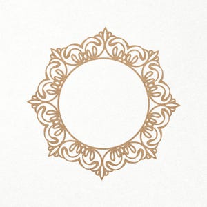 May include: A gold-colored decorative frame with a circular center and intricate floral designs.