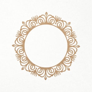 May include: A decorative, circular frame with a delicate, intricate design. The frame is made of a light brown material and has a circular opening in the center.
