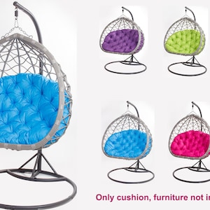 May include: A hanging chair cushion in various colors, including blue, purple, green, pink, and beige. The cushions are designed to fit a hanging chair frame, with a tufted design. The image shows multiple color options.