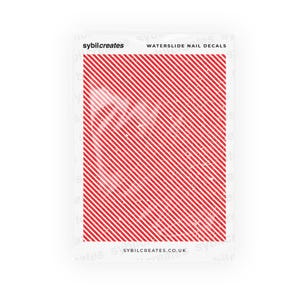 May include: Waterslide nail decals featuring a red and white diagonal striped pattern. The package includes the text "sybilcreates" and "WATERSLIDE NAIL DECALS". The website address sybilcreates.co.uk is also visible.