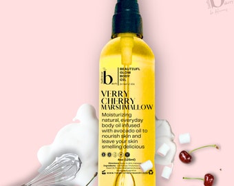May include: A 4 ounce bottle of Verry Cherry Marshmallow body oil. The bottle is yellow and has a white label with black text. The text on the label reads "Beautiful Glow Body Oil for hair & skin" and "Verry Cherry Marshmallow". The bottle is sitting on a pink background with white marshmallows and red cherries.