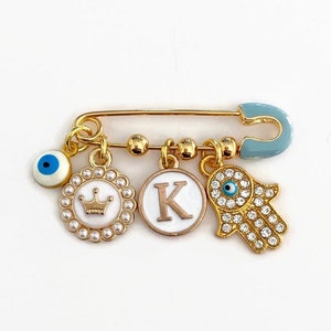 Personalised Mini Evil Eye Baby Clothing Pin, Hamsa Hand, Crown, Letter