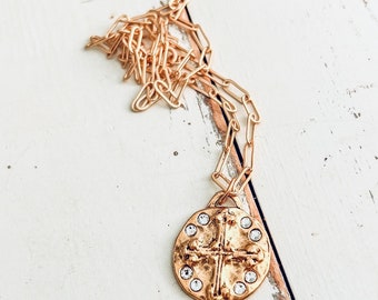 18 inch gold plated chain with gold plated pewter cross and premium Austrian crystals.