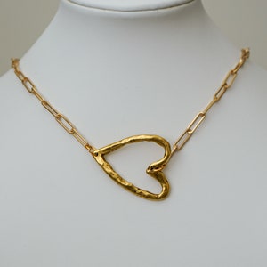Gold pewter, hammered heart link on paperclip chain.