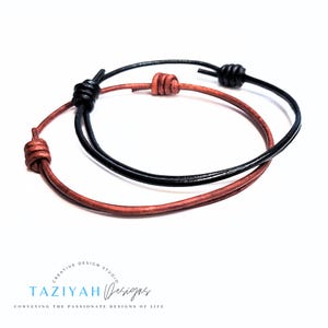 May include: Two leather bracelets, one brown and one black, with knotted ends.