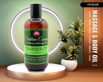May include: A brown glass bottle of Sublime Escapes Tranquility All Natural Massage Oil with hints of pure strawberry and guava. The bottle is 8 ounces (240 ml) and is handcrafted in small batches in the USA.