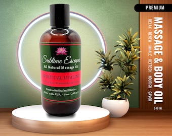 May include: A brown glass bottle of Sublime Escapes all natural massage oil labeled "Spiritual Healing" with hints of pure watermelon and orange. The bottle is 8 oz (240 ml) and handcrafted in small batches. The bottle is on a wooden platform with a white circular base.