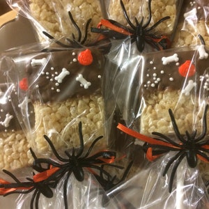 Halloween Cookies.   Rice Krispie Treats Pops dipped in chocolate and decorated for Halloween.  Individually bagged For Safety