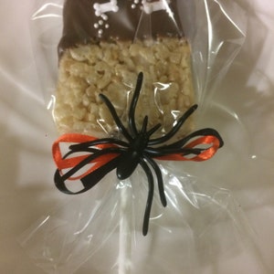 Halloween Cookies.   Rice Krispie Treats Pops dipped in chocolate and decorated for Halloween.  Individually bagged For Safety