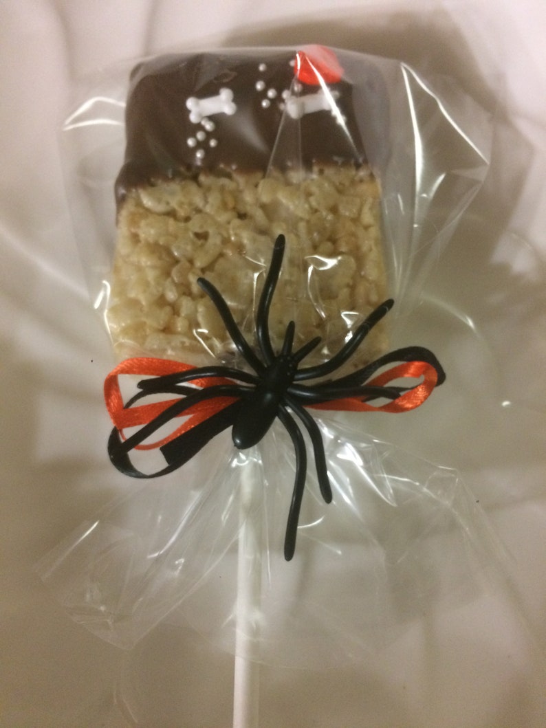 Halloween Cookies.   Rice Krispie Treats Pops dipped in chocolate and decorated for Halloween.  Individually bagged For Safety