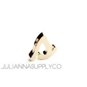 May include: Gold letter charm in the shape of the letter "S".