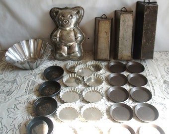 30 cake molds, a tielleSétoise, and individual tarts, steel, 1960s