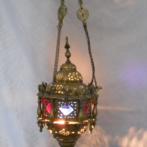 Antique Moorish oriental hanging lantern (Morocco) in bronze and brass suspended by 3 chains and masks