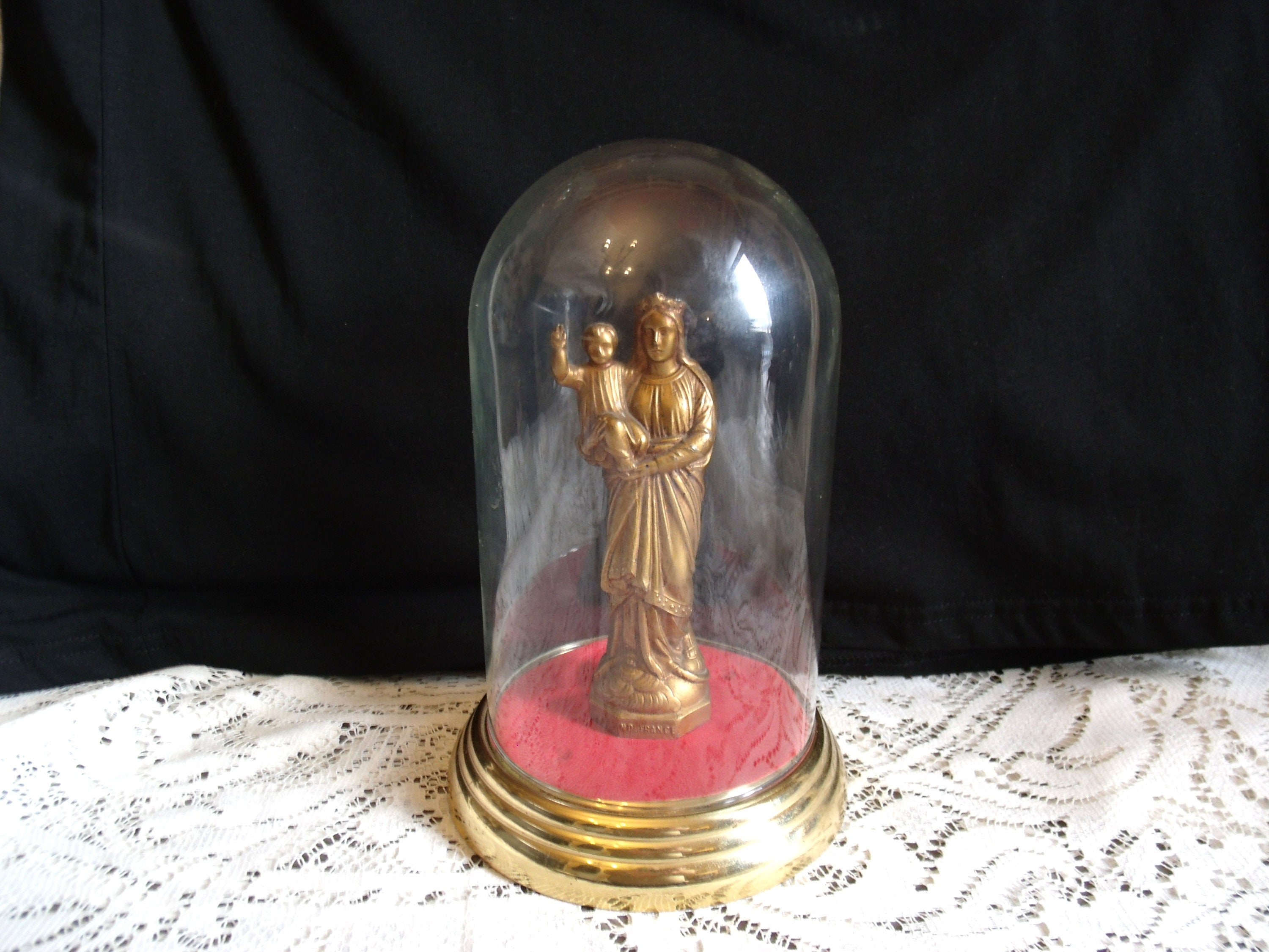 statue Of The Virgin Mary Holding Baby Jesus As Seen in Notre Dame Cathedral Paris.