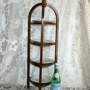 English cake stand or free-standing shelf. Beginning of the 20th century.