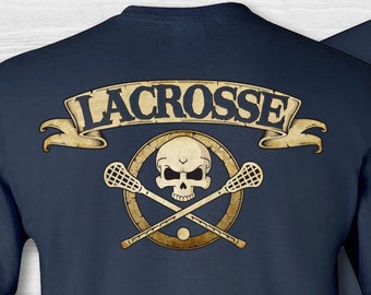 Men's lacrosse skull & crossbones t-shirt. Lacrosse short sleeve tee shirt. Lacrosse 2 sided cotton badge shirt. Lacrosse sport skull shirt.