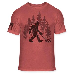 Bigfoot Metal Detector T-Shirt - Funny Sasquatch Metal Detecting shirt - Bigfoot Detectorist shirt - Athletic Soft Blend Tee - A187 Heather Red