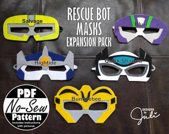 May include: A set of ten felt masks featuring characters from the Rescue Bots series. The masks are in various colors, including yellow, blue, purple, and black. The masks are labeled with the character names: Salvage, Hightide, Blurr, Quick Shadow, and Bumblebee. The text "Rescue Bot Masks Expansion Pack" is printed at the top of the image. The text "PDF No-Sew Pattern" is printed in the lower left corner of the image. The text "Designs by Juli" is printed in the lower right corner of the image.