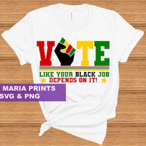May include: White t-shirt with a graphic design that says "VOTE" in red, yellow, and green letters. A black fist is in the middle of the word "VOTE". The text below says "LIKE YOUR BLACK JOB DEPENDS ON IT!" with a yellow star on either side.