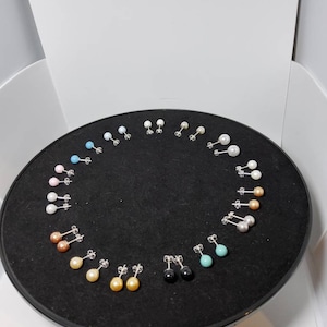 Selection is Swarovski 6mm pearl earrings made with 925 sterling silver posts and butterfly available in a variety of colours