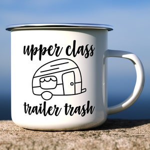 May include: White enamel mug with a black outline of a camper and the text "upper class trailer trash".