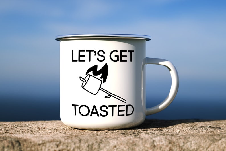 May include: White enamel camping mug with a black graphic of a marshmallow on a stick over a fire. The text "Let's Get Toasted" is printed on the mug.