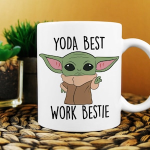 May include: White ceramic mug with a green cartoon character with large ears and the text "YODA BEST WORK BESTIE".