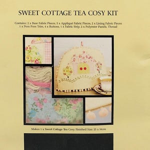 May include: A craft kit for a Sweet Cottage Tea Cosy. The packaging is tan with the text "SEW & SO ON docrafts" and "SWEET COTTAGE TEA COSY KIT". The kit includes fabric pieces, buttons, trim, and thread. Finished size is 25 x 34cm.
