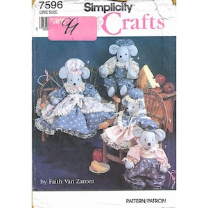 May include: Simplicity Crafts pattern featuring four stuffed mouse dolls in various outfits. The dolls are dressed in blue and pink floral dresses and overalls, with matching hats. The pattern is by Faith Van Zanten.