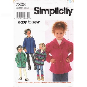 May include: A Simplicity sewing pattern envelope, number 7308, size BB 5, 6, 7, 8. The front displays illustrations of four different jacket styles for children, including a pink fringed jacket, a blue jacket with leopard print trim, and others.