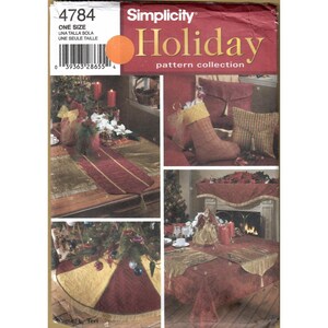 May include: Simplicity Holiday pattern collection featuring various Christmas-themed sewing projects. The image showcases a tree skirt, table runner, stockings, and other decorative items in red, gold, and green.