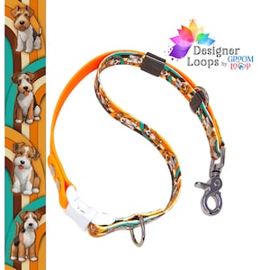 May include: Orange dog collar with a pattern of cartoon wirehaired fox terriers on a teal, orange, and brown background. The collar has a white plastic buckle and a silver metal clip.