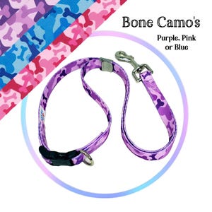May include: Purple, pink, or blue dog collar and leash set with a bone camo pattern. The leash has a silver clip.
