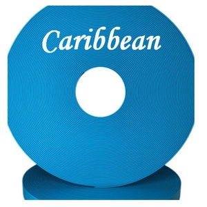 May include: A roll of bright blue webbing with the word "Caribbean" printed on it.