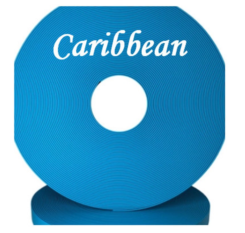 May include: A roll of bright blue webbing with the word "Caribbean" printed on it.