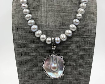 11mm silver ringed pearls with 37mm x 35mm blister pearl with cz pendant