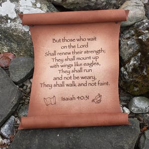 May include: A brown leather scroll with a quote from Isaiah 40:31, "But those who wait on the Lord Shall renew their strength; They shall mount up with wings like eagles, They shall run and not be weary, They shall walk and not faint."