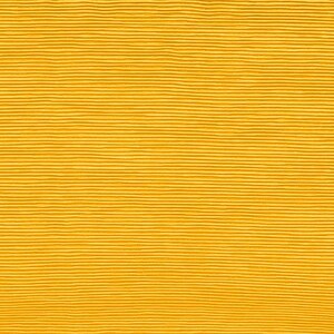 May include: A close-up of a yellow textured fabric with horizontal lines.