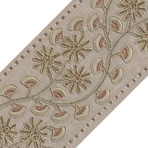 May include: A beige fabric trim featuring an embroidered botanical pattern of stylized flowers and fan-shaped leaves in shades of tan, copper, and cream. The design runs vertically along the center of the textured, woven textile strip.